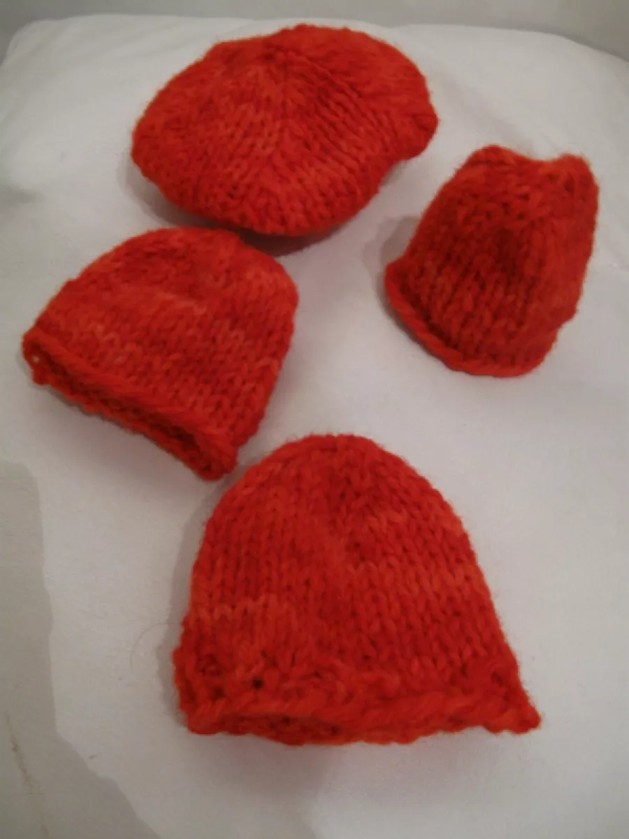 Four egg cosies